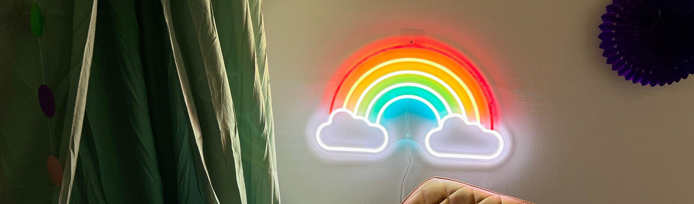 Neon rainbow mounted on a white wall