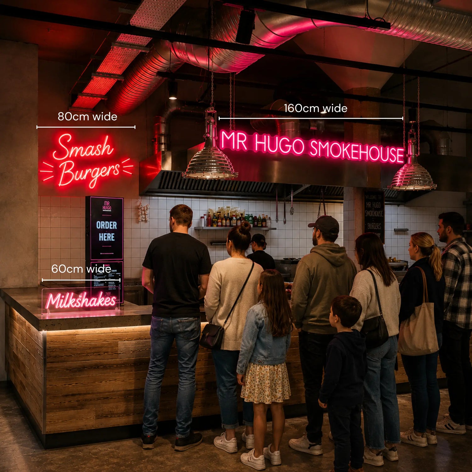 A group of people standing in a restaurant or cafe queue area, facing a counter with neon signs including 'Smash Burgers', 'MR HUGO SMOKEHOUSE', and 'Milkshakes'. White dimension lines with text labels '80cm wide', '160cm wide', and '60cm wide' are overlaid on the scene.