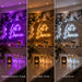 Three vertical panels show a decorated event space with a large illuminated 'Let's Dance' sign above a dessert table, balloon garlands, candles, and champagne flutes. The left panel glows purple, the center panel is warm white, and the right panel is cool white.