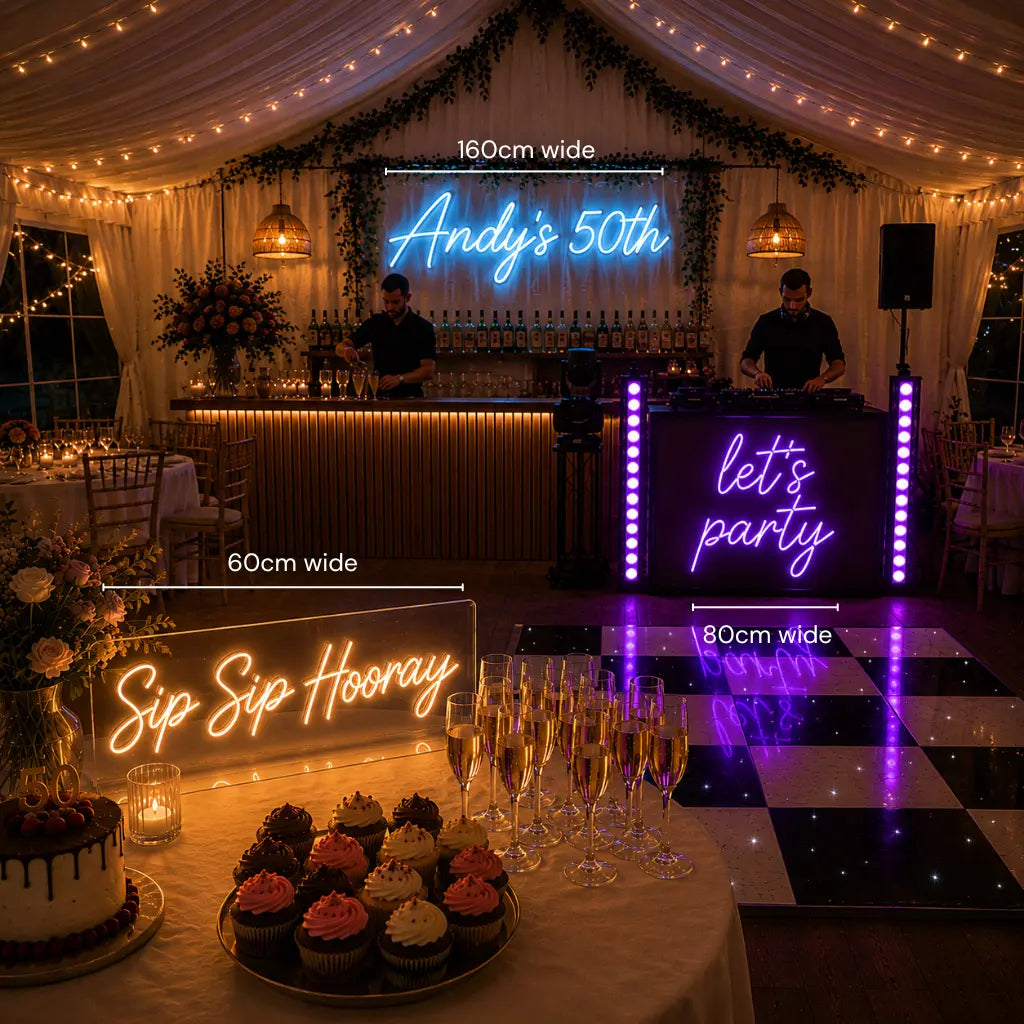A wedding or party event setup inside a decorated event tent, showing multiple illuminated neon signs with size labels overlaid: a large back wall sign reading 'Andy's 50th' (160cm wide), a DJ booth side sign reading 'let's party' (80cm wide), and a table sign reading 'Sip Sip Hooray' (60cm wide). The scene includes a bar station, dance floor, cupcakes, champagne glasses, draped curtains, string lights, and floral decor.