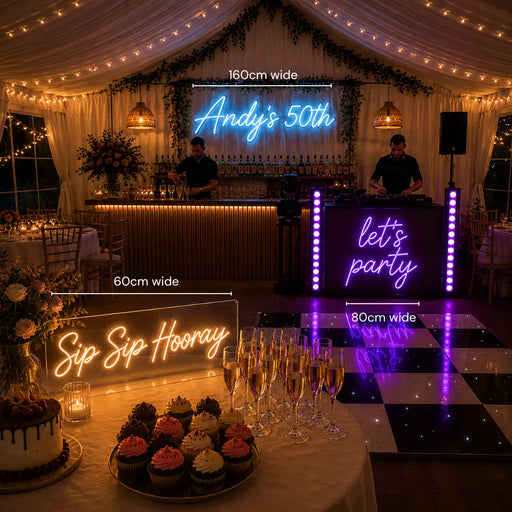 A wedding or party event setup inside a decorated event tent, showing multiple illuminated neon signs with size labels overlaid: a large back wall sign reading 'Andy's 50th' (160cm wide), a DJ booth side sign reading 'let's party' (80cm wide), and a table sign reading 'Sip Sip Hooray' (60cm wide). The scene includes a bar station, dance floor, cupcakes, champagne glasses, draped curtains, string lights, and floral decor.