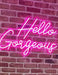 Hello Gorgeous Neon Sign against brick wall
