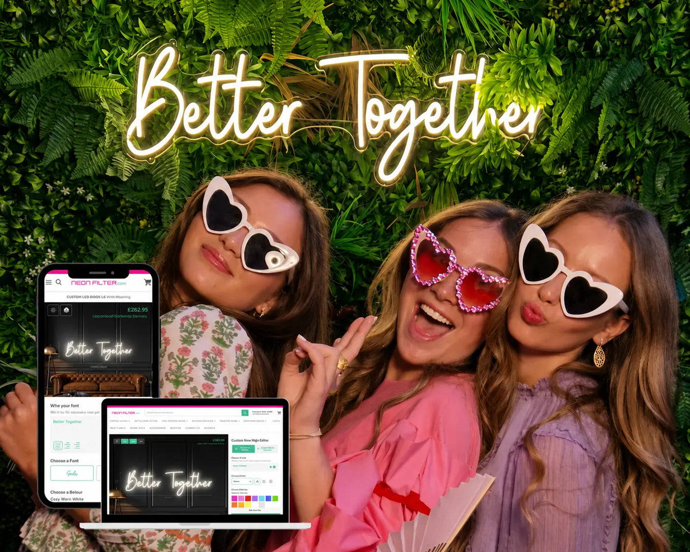 Three women wearing heart-shaped sunglasses with a 'Better Together' neon sign and digital devices in front of a green leafy background.