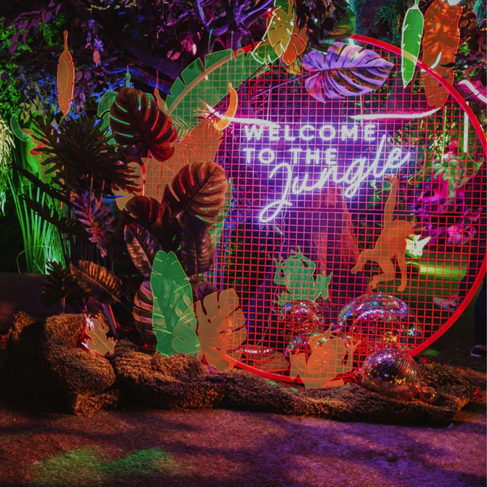 Purple Welcome to the Jungle neon sign in party environment taken by EPH Creative