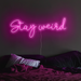 Stay weird neon sign in love potion pink