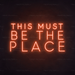 This Must Be The Place Neon Sign in Sunset Orange