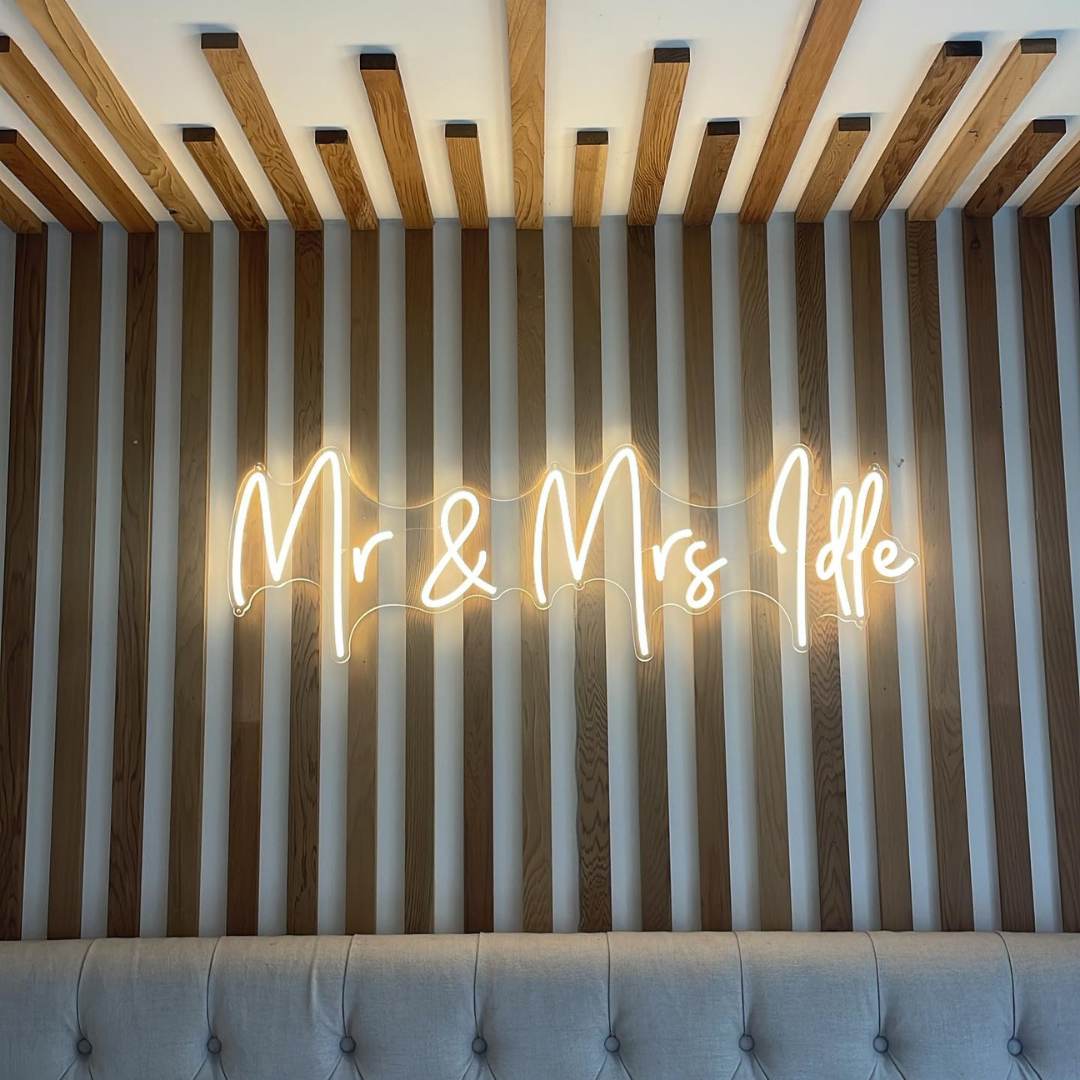 cosy warm white Surname Wedding Neon Sign at home.jpg__PID:e97ce62f-9792-489d-8435-636a01ce8725