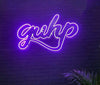 Purple "Guhp" neon logo sign on brick wall.