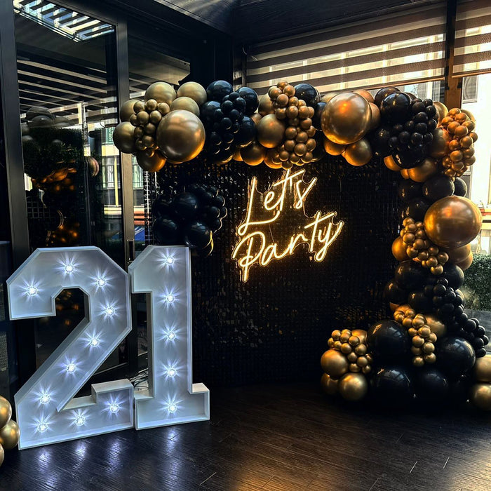 Let's Party LED Sign in Cosy Warm White Image from @occasionsbytori on Instagram.
