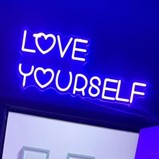 Love Yourself Neon Sign in Santorini Blue. Photo by the_powder_rooms_aesthetics on Instagram.