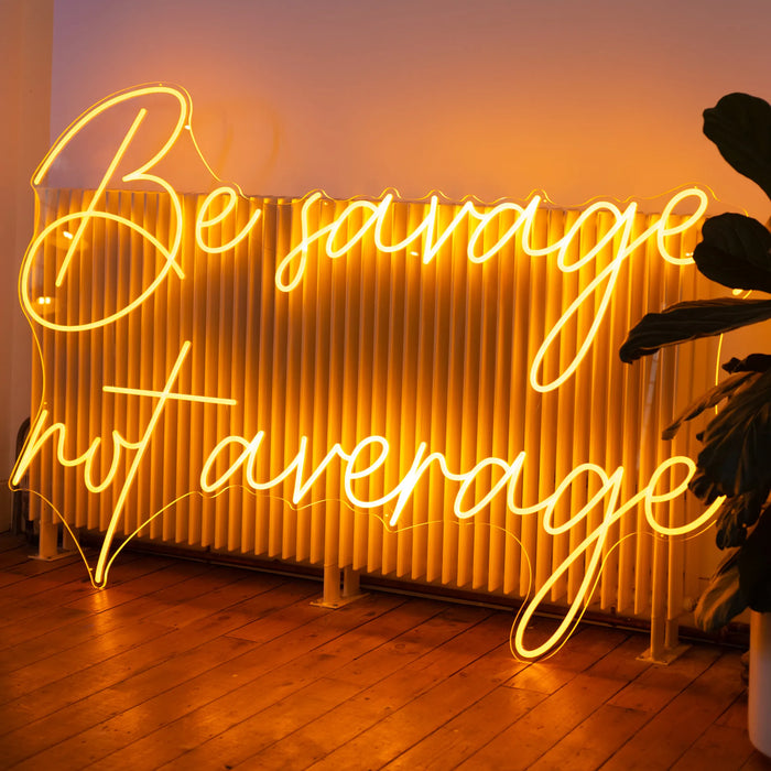 Be Savage, Not Average neon sign in warm white