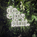 Do Epic Stuff Neon Sign in snow white on plant wall background