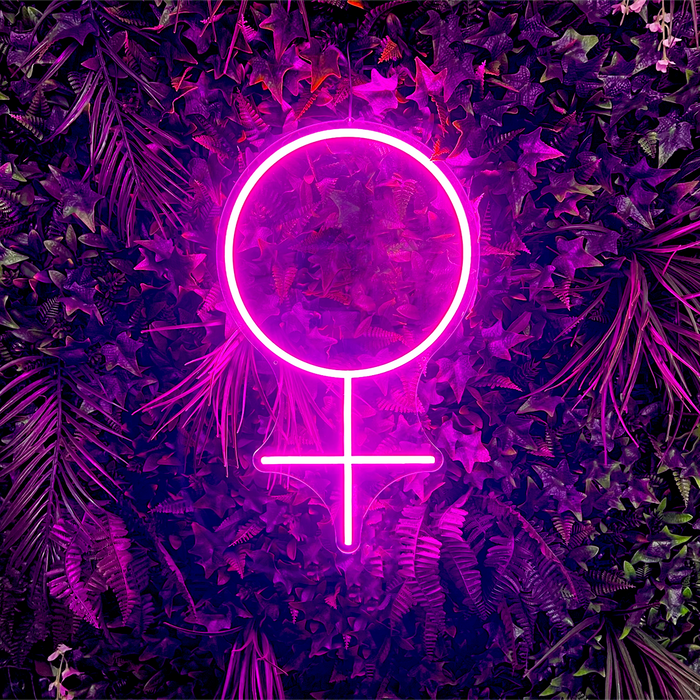 Female Symbol Neon Sign in bright hot pink