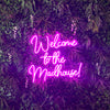 Welcome to the madhouse neon sign in love potion pink