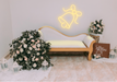 Yellow wedding bell neon sign over classy white sofa