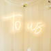 To Us Neon Sign in Cosy Warm White